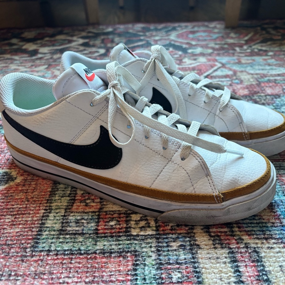 Nike White and Black Sneakers with Gold Accent